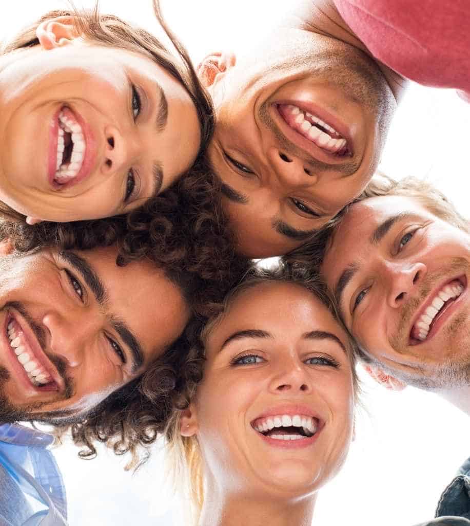 Smiling person showcasing white teeth after laser whitening treatment Bradford